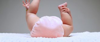 Baby in pink diapers