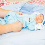 Одевание новорожденного